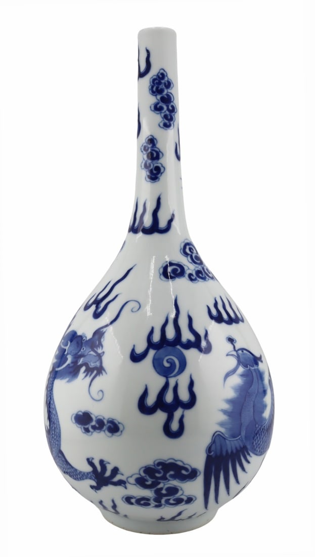 19th C Chinese Dragon and Phoenix Vase.: 19th century Chinese blue and white bottleneck vase displaying a dragon and phoenix flanking a flaming pearl and further surrounded by ruyi clouds and flames. Pictorial mark to the underside. From a D