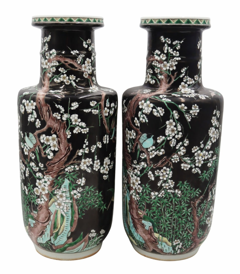 Pair of Chinese Famille Noir 'Birds and Flowers': Vases. Pair of Chinese Famille Noir enamel decorated vases displaying birds perched in the branches of flowering trees. Blue double ring mark to the underside. From a Great Neck, NY estate.