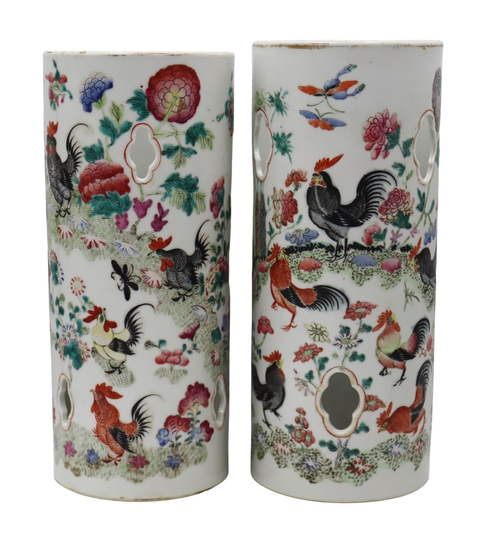 Near Pair of Chinese Famille Rose Hat Stands.: Pair of Chinese Famille Rose enamel decorated hat stands decorated with roosters, flora, butterflies, and lingzhi. Further accented by quatrefoils form open pendants. Signed to the underside of each. 