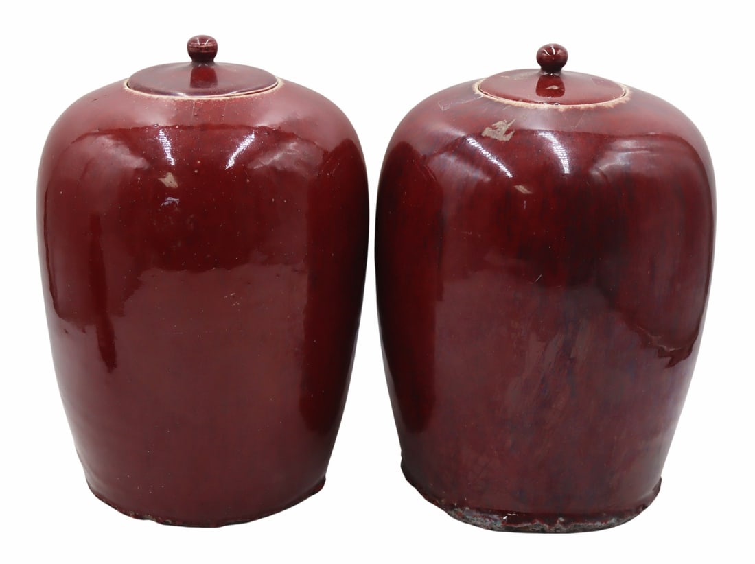 Pair of Chinese Sang de Beouf Lidded Jars.: From a Queens, NY estate. Dimensions: lidded urns measure approx. 11.5" high.