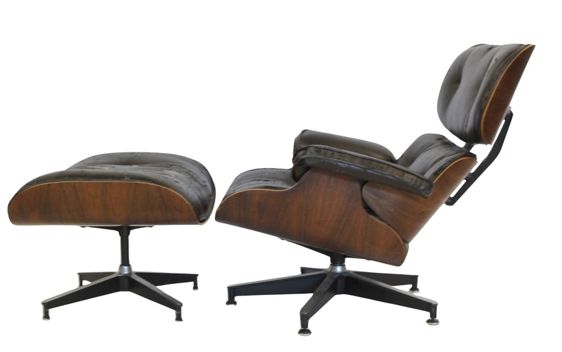 Charles Eames Rosewood Lounge Chair & Ottoman.: Lounge chair and ottoman, upholstery as / is. From a New York City estate. Dimensions: chair: 31" x 33" x 33" & Ottoman 16" x 25" x 21".