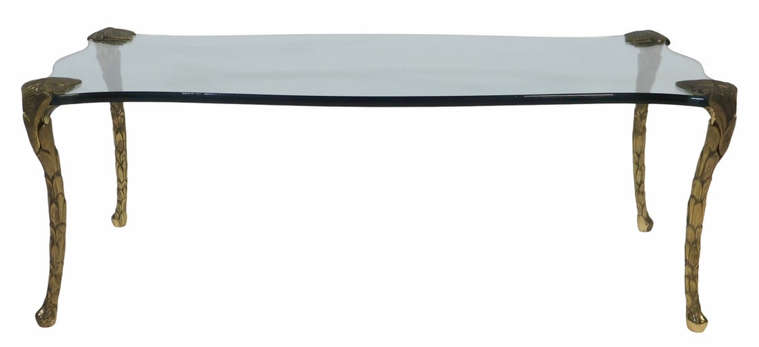 After Maison Jansen Fine Quality Coffee Table.: Heavy and quality bronze legs and nice original thick shaped glass top. From a Kings Point, Long Island, NY estate. - Dimensions: 17" h x 48" w x 24" d.