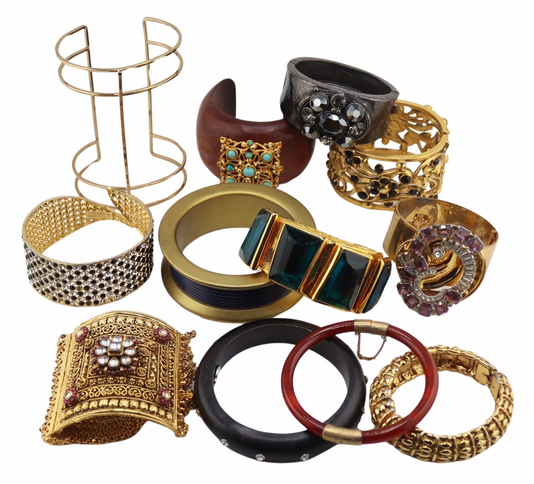 JEWELRY. Collection of (12) Statement Bracelets.: Includes a Barrera gold-tone wide hinged bracelet displaying flowers accented by black and gold rhinestones; a Correra Italian gold-tone bracelet accented by alternating black and white/clear rhinesto