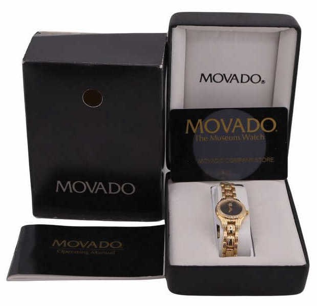 JEWELRY. Lady's Movado 14kt Gold Diamond Bracelet: Watch. A 14kt yellow gold ladies’ Movado quartz bracelet watch. This watch features a black dial accented by gold dauphine hands and a single applied gold-tone dot at the 12 o’clock positi
