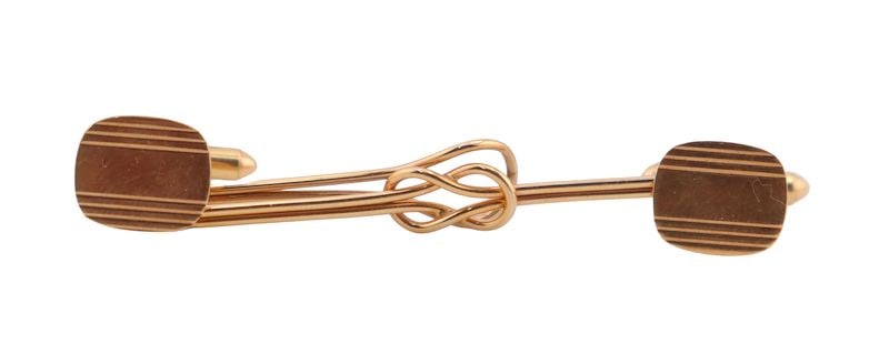 JEWELRY. Men's 10kt Gold Jewelry Grouping.: Including a 10kt yellow gold tie slide - stamped, "10K"; and a pair of of 10kt yellow gold toggle back cufflinks - stamped, "10K". Total approx. weight of all items is 6.3 dwt