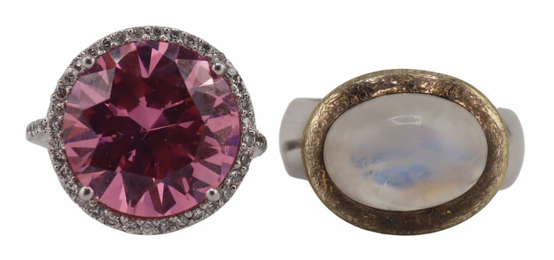 JEWELRY. (2) Signed Cocktail Rings.: Includes a signed Edwin Pearl sterling ring displaying a round faceted pink rhinestone and rhinestone ring - stamped, "E.Pearl 925", ring size - 6; and a Milestone sterling, gilt and moonsto