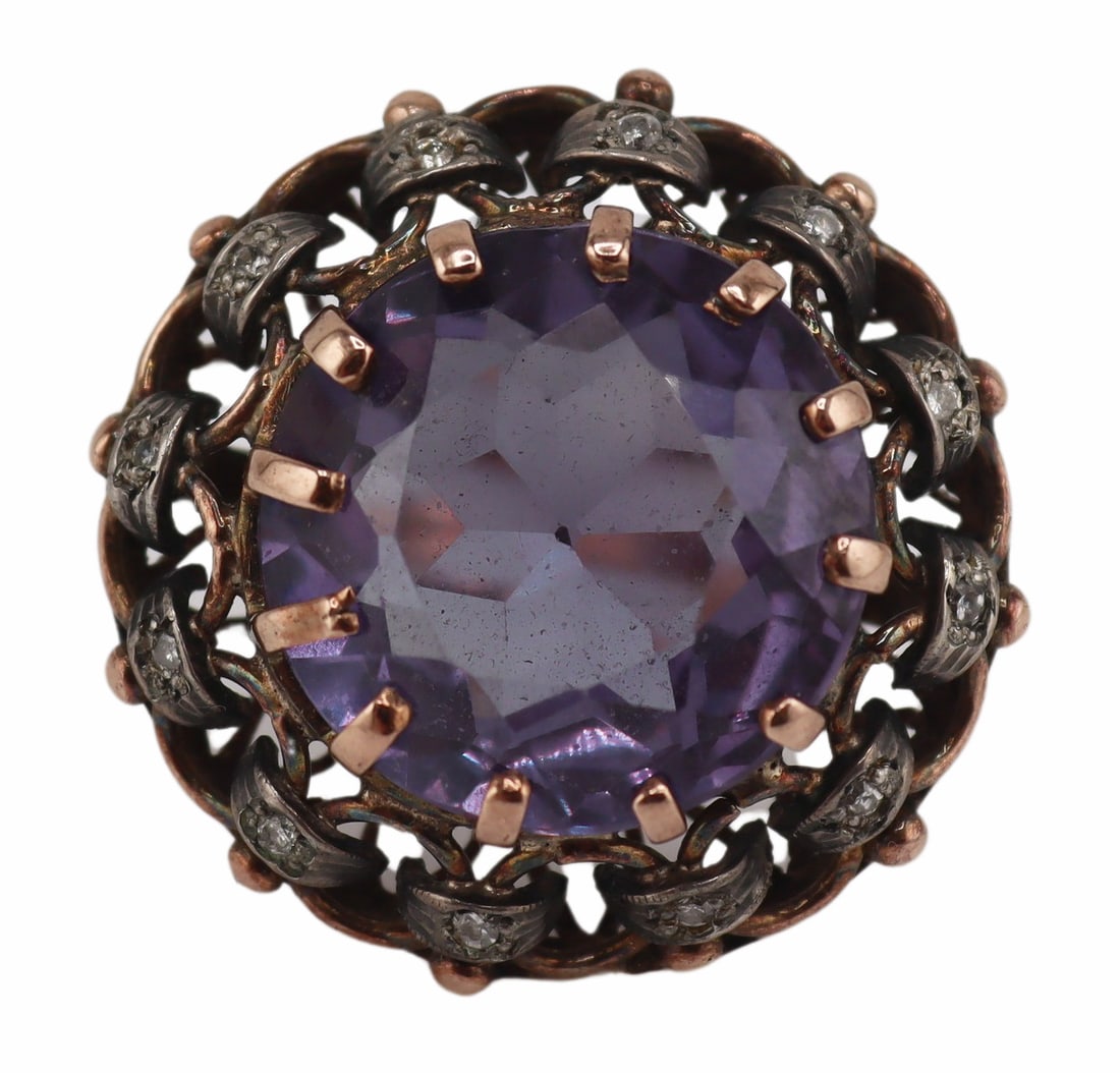 JEWELRY. 12.5kt Gold, Color Change Sapphire and: Diamond Cocktail Ring. Vintage 12.5kt yellow gold cocktail ring displaying a central round faceted synthetic color change sapphire surrounded by an ornately woven surround with pave diamond inlaid