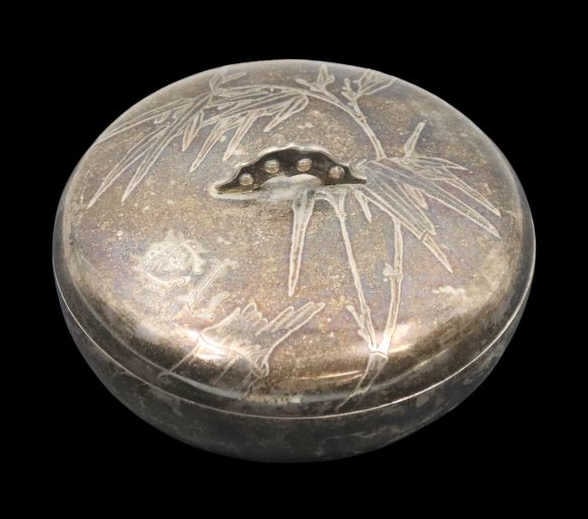 SILVER. Chinese Export Silver Luen Wo Lidded Box.: A finely crafted monogrammed Chinese Export silver lidded box by Luen Wo, Shanghai. The exterior is adorned with a bamboo motif . The lid bears a finely executed period monogram and a stylized handle.