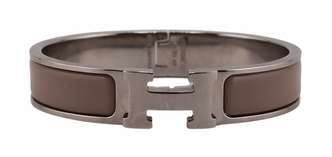 COUTURE. Hermes Clic H Bracelet.: Hermes Clic H palladium plated bracelet with marron glace enamel, and 'H' toggle clasp. Stamped to the interior of the bracelet, "Hermes F1 02 40 Made in France". From a Scarsdale, NY estate
