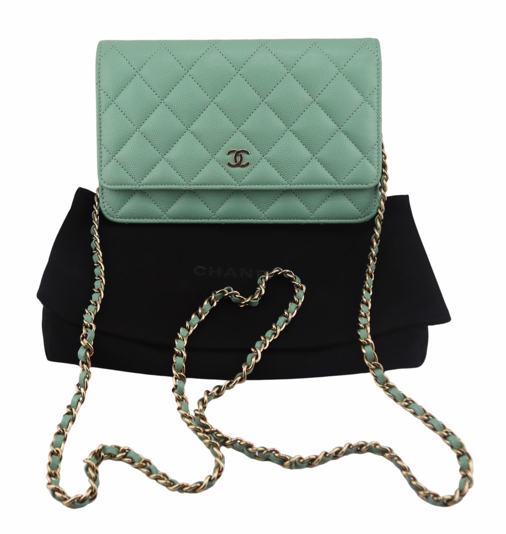 COUTURE. Chanel Mint Green Quilted Leather: Clutch Bag. Chanel mint green quilted caviar leather classic cluth bag with gold-tone hardware. Woven chain and mint green leather shoulder strap. With interior Chanel plaque, no. H76U7LJ4. With Chane