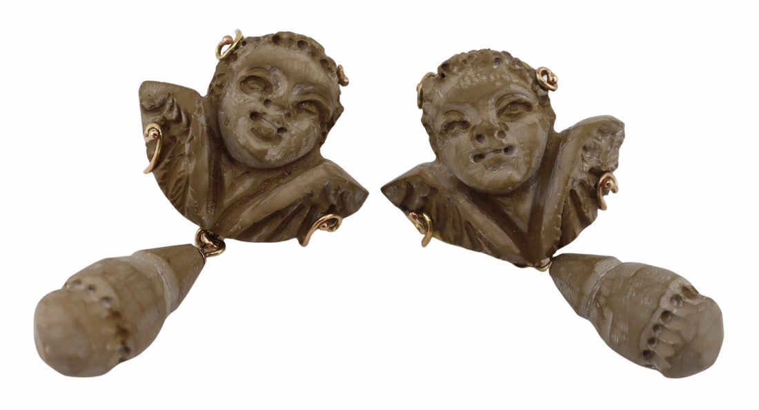 JEWELRY. Pair of Antique 12kt Gold and Lava Cameo: Earrings. Pair of 12kt yellow gold mounted carved lava cameo earrings displaying a winged putti and drop pendant. Presumably later mounting. Apparently unmarked. Total approx. weight of the earrings i