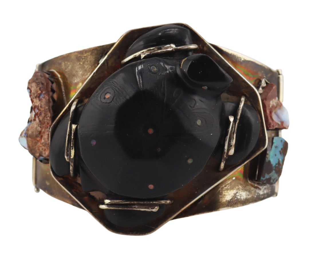 JEWELRY. Signed Sterling, Opal and Carved Wood: Bracelet. Signed sterling bracelet displaying a central carved wood turtle accented by flush set opal slices, and flanked by (3) bezel set opals in matrix. Signed, "Sterling Silver" with an 