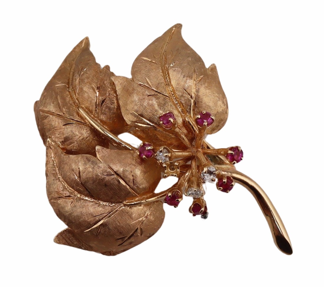 JEWELRY. 13.25kt Gold, Ruby and Diamond Brooch.: Vintage 13.25kt yellow gold foliate form brooch accented by (7) prong-set round faceted rubies and (3) prong-set round faceted rubies. Apparently unmarked. Total approx. weight of the brooch is 12.2 d