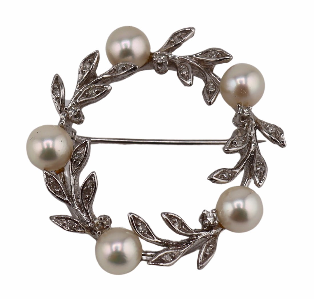 JEWELRY. 13.25kt Gold Pearl and Diamond Wreath: Brooch. Vintage 13.25kt white gold wreath form brooch displaying pave diamond accents and (5) round pearls. Total approx. weight of the brooch is 4.4 dwt (gross). From a Mamaroneck, NY estate. Dimensi