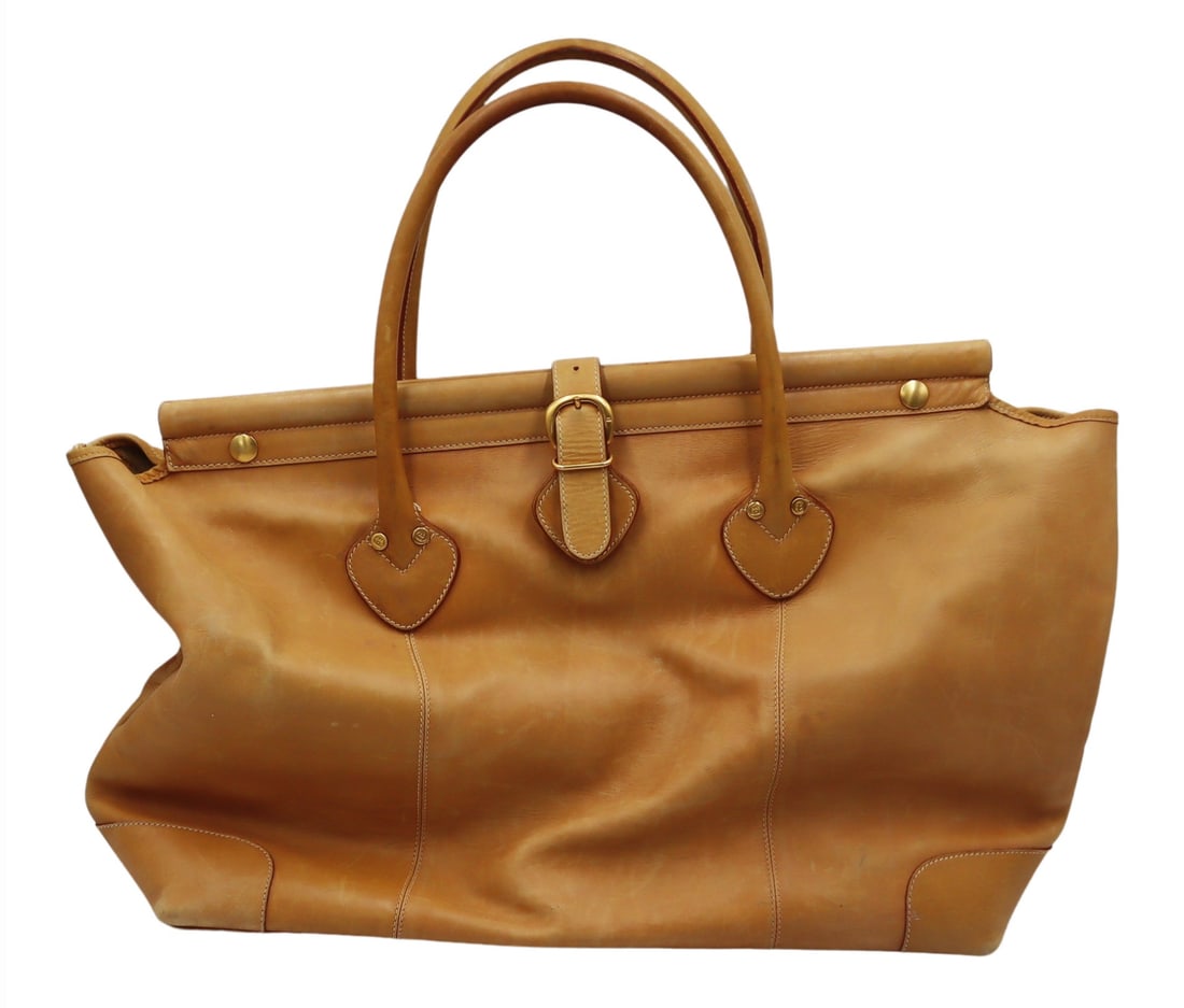 COUTURE. Gucci Tan Leather Travel Bag.: Gucci tan leather travel bag with gold-tone hardware, snap closures, a flap over magnetic buckle form closure, and one interior zippered pocket. With a gold-tone placard signed, "Gucci Made in It