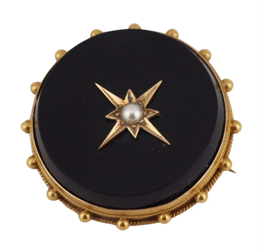 JEWELRY. Victorian 9kt Gold, Onyx and Pearl Hair: Locket Brooch or Pendant. Victorian 9kt gold circular brooch displaying an onyx panel with central applied star pendant with single pearl. Border is accented by applied ball form pendants. With hair l