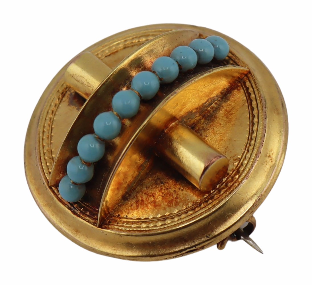 JEWELRY. Victorian Gold and Blue Enamel Brooch: Or Pendant. Victorian gold circular brooch or pendant with central band of (10) light blue enamel beads. C-clasp, bail, and locket verso. The brooch has been gilt with a higher karat gold finish and