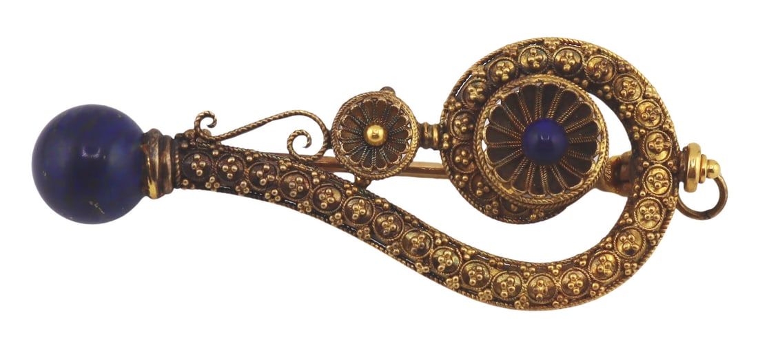 JEWELRY. Victorian Etruscan Revival Gold and Lapis: Lazulis Brooch or Pendant. Victorian Etruscan Revival gold brooch displaying granulation, scrolling wire work, a single Lapis Lazulis bead, and terminating in a globe form Lapis Lazulis pendant