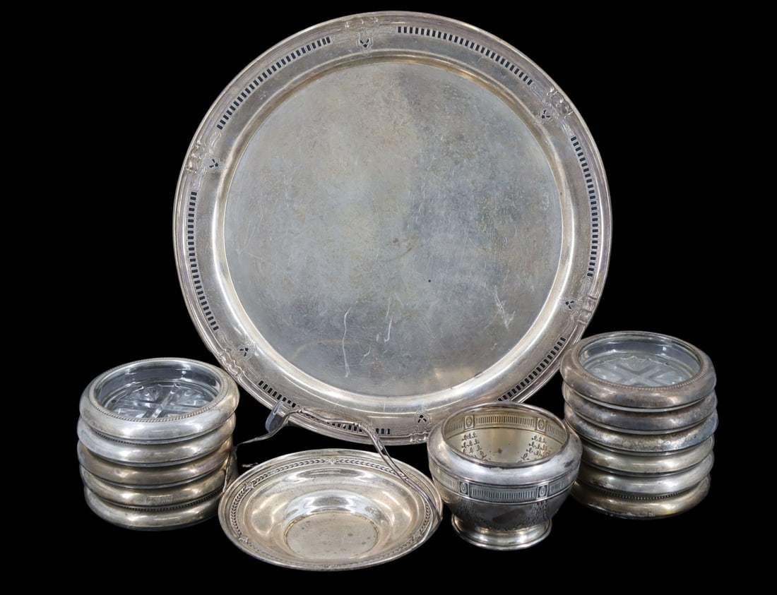 STERLING. Assorted Sterling Hollowware.: Including (11) sterling mounted glass coasters - stamped, "Sterling"; a sterling vessel - stamped, "Sterling"; a sterling petite round tray with handle - stamped,