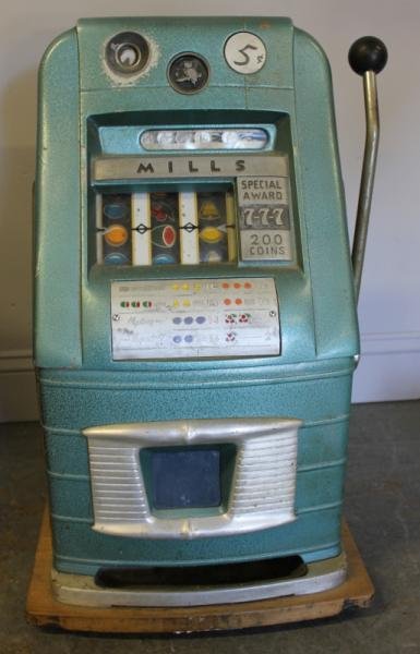 Mills Slot Machine.: From a Katonah, NY home. Dimensions: 16" w x 15.75" d x 26.875" h.