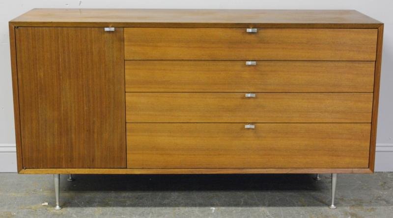 George Nelson Chest By Herman Miller.: 3 drawer and 1 door chest raised on aluminum feet with aluminum Y-pulls. From a Rye, NY estate. Condition: Good, with small chip back of right side. Dimensions: 56" w x 19" d x 31" h.