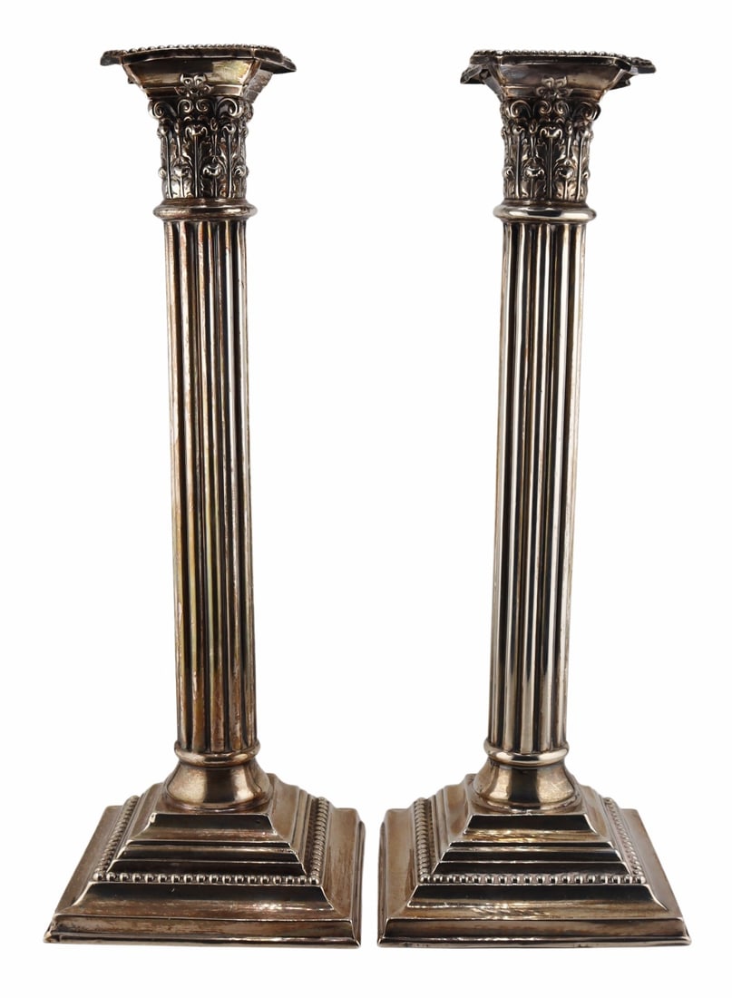 STERLING. Pair of Mauser Sterling Column Form: Candlesticks. Pair of Mauser Manufacturing Co. weighted sterling column form candlesticks on plinth bases with removable bobeches. Stamped to the underside, "Sterling 925-1000 Fine 5629 12 Inch&q
