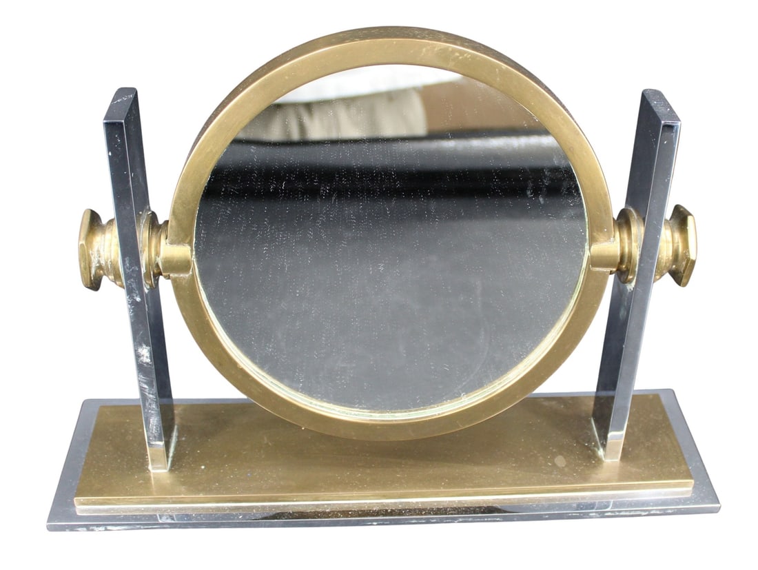 MidCentury Modern Mirror Style of Karl Springer: A fine quality Mid Century modern dresser mirror possibly Karl Springer. One side of the mirror is standard, one side is magnifying. Unsigned. Mirror is 8.5" in diameter. From a Larchmont, NY est