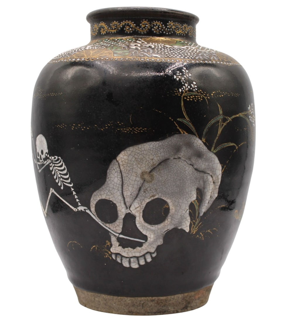 Japanese Satsuma Skeleton Enamel Decorated Vase.: Japanese Satsuma enamel decorated vase decorated in gold, white and green accents. Of ovoid form decorated with skeletons on a black ground. The exterior of the piece depict three skeletons as well as