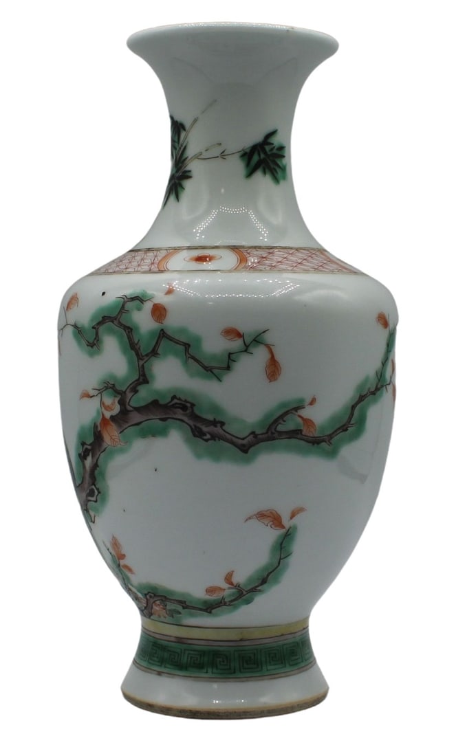 Chinese Famille Verte Bird & Branch Vase.: Chinese porcelain Famille verte vase with birds and trees depicted on the exterior. There are additional depictions of bamboo, butterflies and leafs as well on the exterior. there is additi0onally red