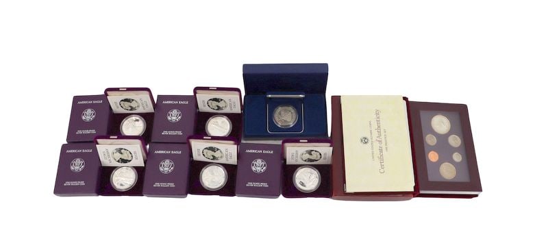 BULLION. (5) 1986 $1 Silver Eagles OGP.: Including (6) 1986 S $1 Proof Silver Eagle Coins, each struck in 1 Troy Ounce of .999 Fine Silver. The total mintage for this date & mint mark with a proof finish: 1,446,778. Accompanied by a (1) 