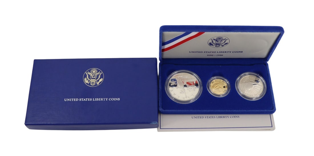 NUMISMATICS 1986 3-Coin Commem Statue of Liberty: Proof Set. Including (1) 1986 W $5 Proof Statue Of Liberty Commemorative gold coin, struck in .900 fine gold. The total mintage for this date & mint: 404,013. (1) 1986 S $1 Proof Statue Of Liberty