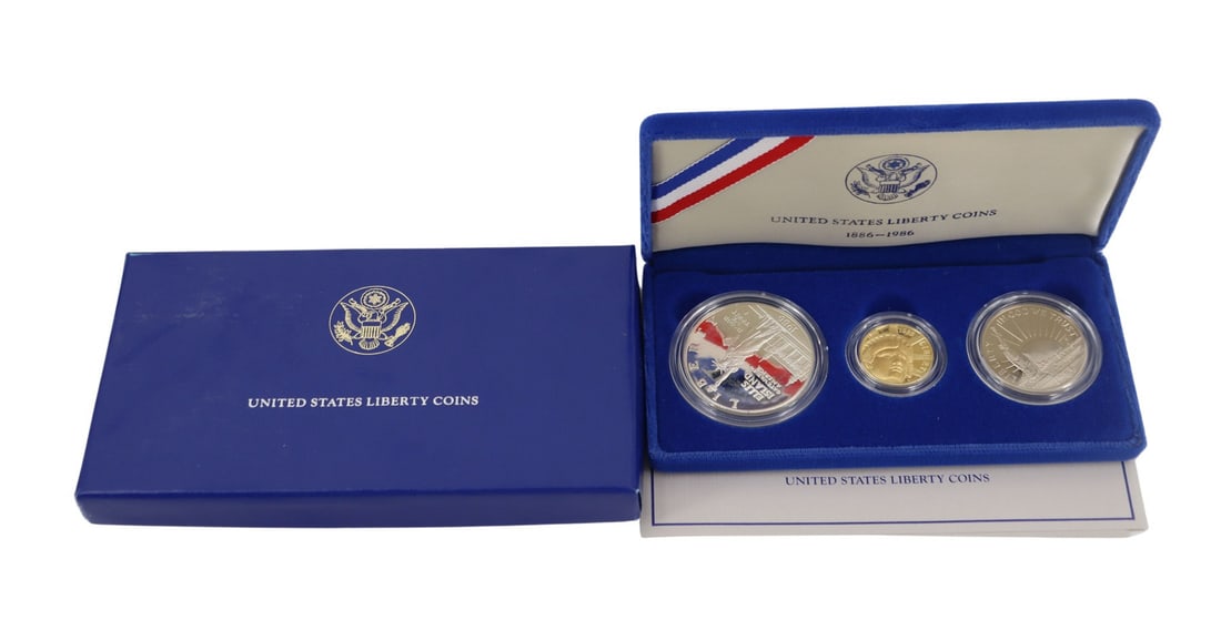 NUMISMATICS 1986 3-Coin Commem Statue of Liberty: Proof Set. Including (1) 1986 W $5 Proof Statue Of Liberty Commemorative gold coin, struck in .900 fine gold. The total mintage for this date & mint: 404,013. (1) 1986 S $1 Proof Statue Of Liberty