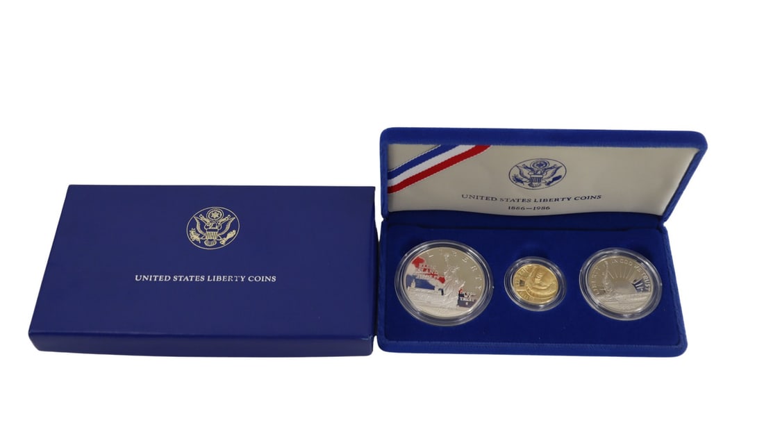 NUMISMATICS 1986 3-Coin Commem Statue of Liberty: Proof Set. Including (1) 1986 W $5 Proof Statue Of Liberty Commemorative gold coin, struck in .900 fine gold. The total mintage for this date & mint: 404,013. (1) 1986 S $1 Proof Statue Of Liberty