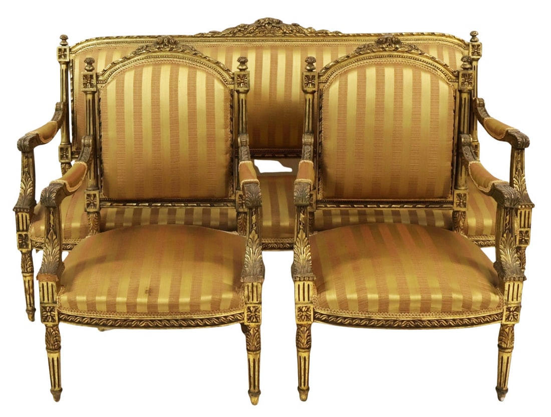 Louis XV1 Style Finely Carved Giltwood Settee &: Armchairs. Nice 3 piece set with nice gilt patina, finely carve and with nice striped upholstery. From a Kings Point, LI estate. Dimensions: Settee: 24" h x 70" w x 39" w x 24" d a