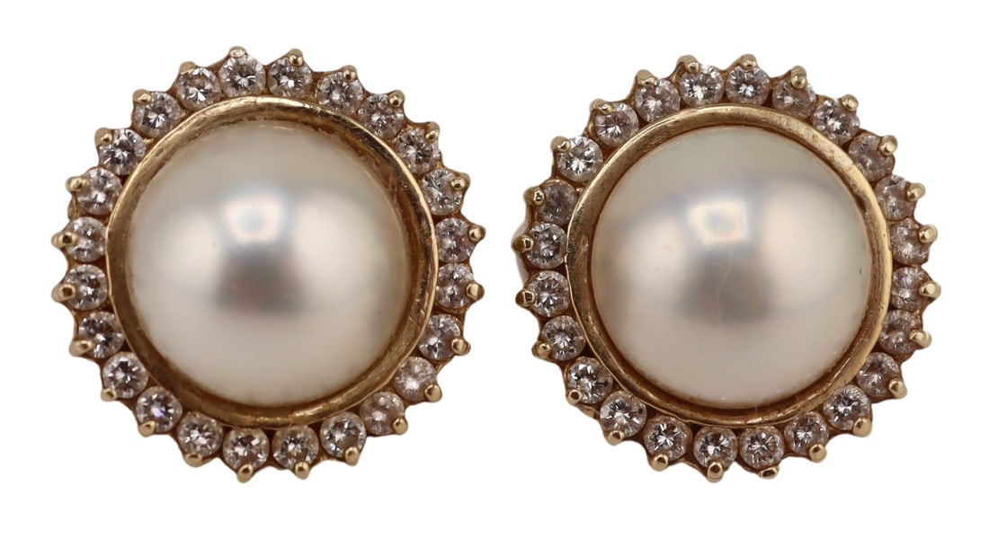 JEWELRY. 14kt Gold Mabe Pearl & Diamond Earrings.: Pair of 14kt yellow gold mabe pearl earrings with pave diamond surrounds. One post stamped, "G14K". Each earring is surrounded by 24 pave diamonds. Total approx. weight of the pair of earrin