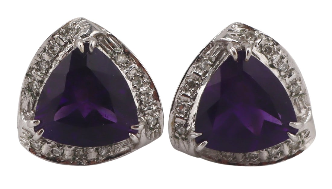JEWELRY. Pair of Signed 14kt Gold, Amethyst and: Diamond Earrings. Pair of signed 14kt white gold triangular form earrings displaying central prong-set faceted amethyst with pave diamond surrounds. Amethysts measure approx. 10.0mm x 9.5mm. Stamped v