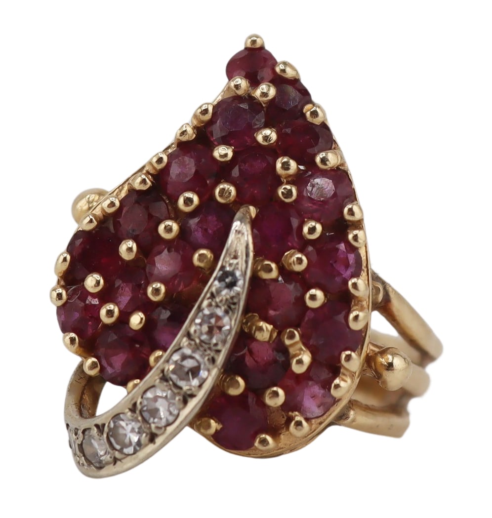 JEWELRY. 14kt Gold, Ruby and Diamond Leaf Form: Ring. Vintage 14kt yellow gold leaf form ring displaying (22) round faceted rubies and an applied 14kt white gold band accented by (7) pave diamonds. Stamped, "CR? 14K". Total approx. weight