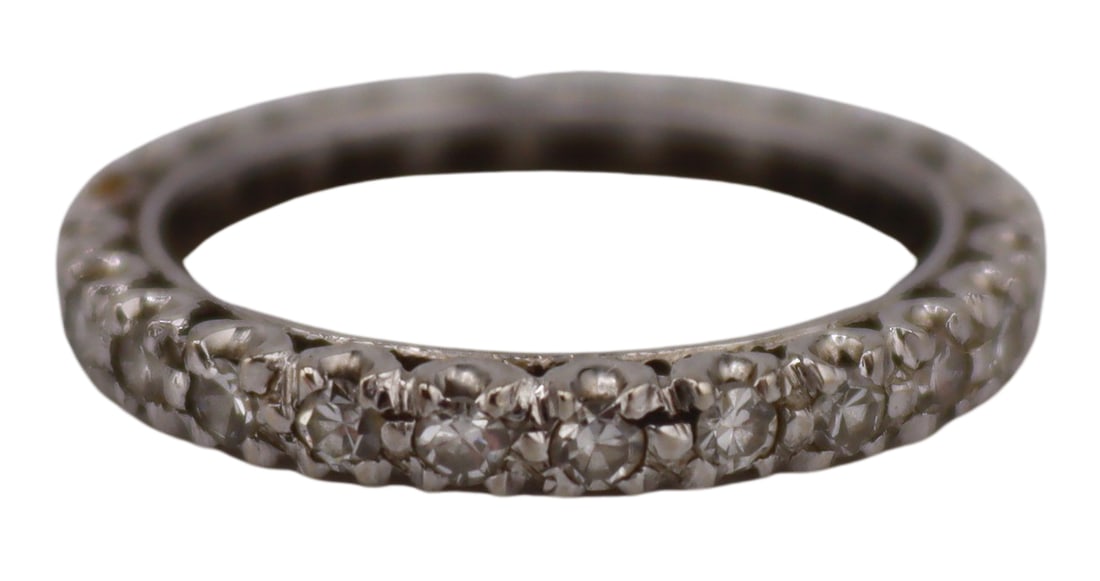 JEWELRY. 13kt Gold and Diamond Eternity Band Ring.: 13kt white gold and single cut diamond eternity band ring. Apparently unmarked. Total approx. weight of the ring is 1.2 dwt (gross). Ring size - 5. From a Larchmont, NY estate. Dimensions: ring measur