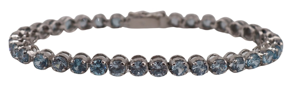 JEWELRY. 18kt Gold and Blue Gem Line Bracelet.: 18kt white gold line bracelet displaying (36) round faceted blue gems. Gems measure approx. 4.0mm each. Stamped, "750". Total approx. weight of the bracelet is 10.2 dwt (gross). From a Larch