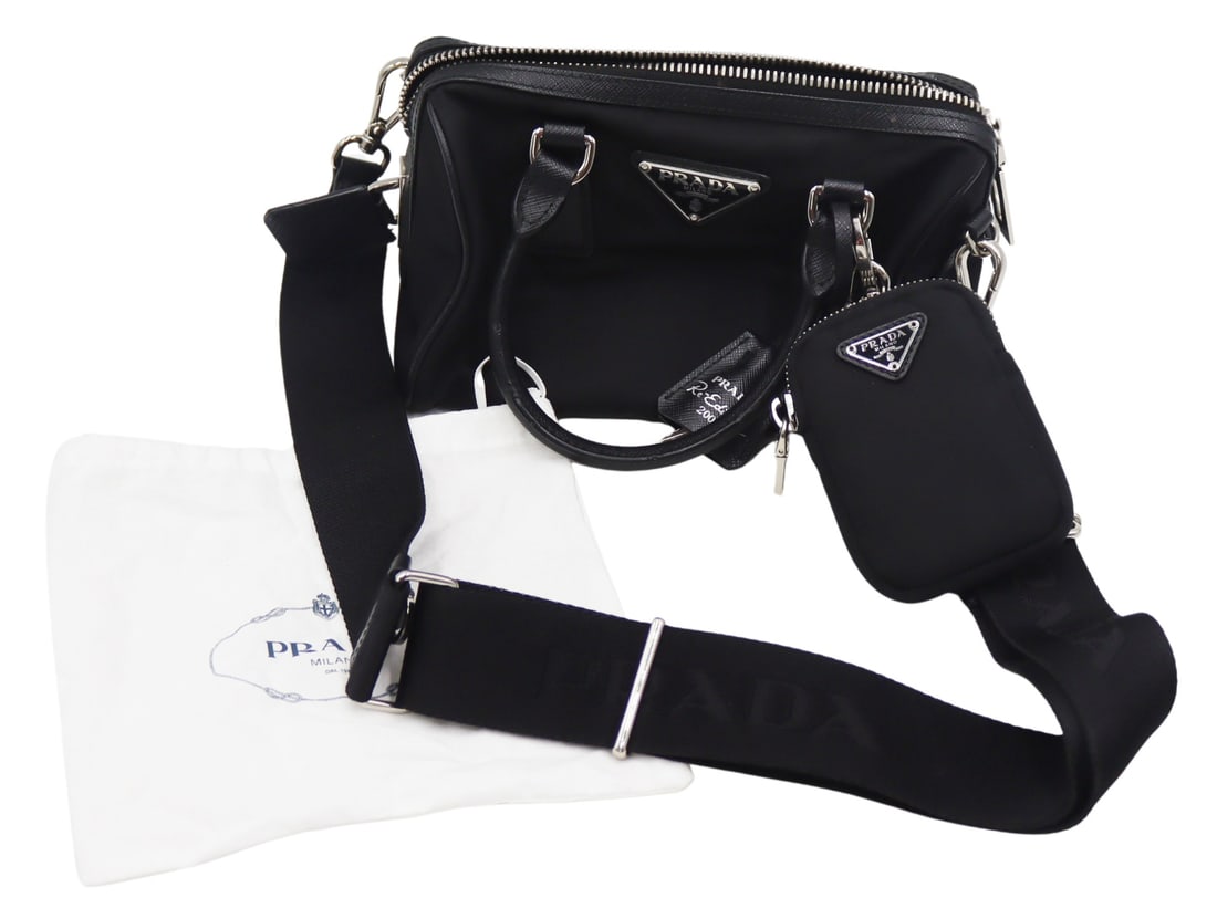 COUTURE. Prada Saffiano Re-Edition 2005 Purse.: Prada Saffiano Re-Edition 2005 nylon messenger crossbody bag with top handles. With black leather trim and silver-tone hardware. With a black nylon adjustable shoulder or cross body strap inscribed, &
