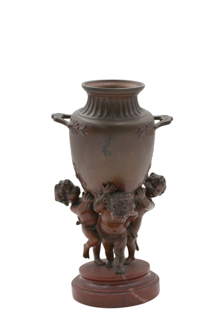 After MOREAU Bronze Urn Held Up By (3) Putti: Nice original bronze on rouge marble base. From a NYC collection. - Dimensions: 5.5" x 9"