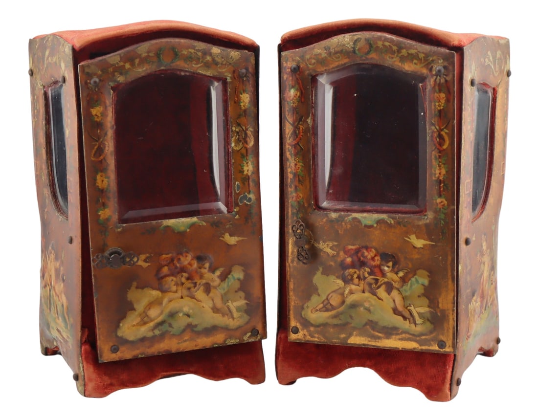 Pair of Porte-Mondre or Chair Form Display Cases.: Pair of Victorian Porte-Mondre or Sudan chair form display cases or watch holders accented by painted scenes of putti, floral swags and ribbon decoration, red velvet panels and lining, and (3) beveled