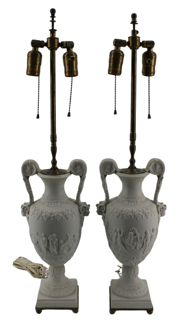 Fine Antique Pair Of Classical Parian Porcelain: Urns As Lamps. Good size and the finest of quality. Mounted on brass base with bunn feet. From a Harrison, NY estate. - Dimensions: 15" h x 7" w, to finial 28" h.