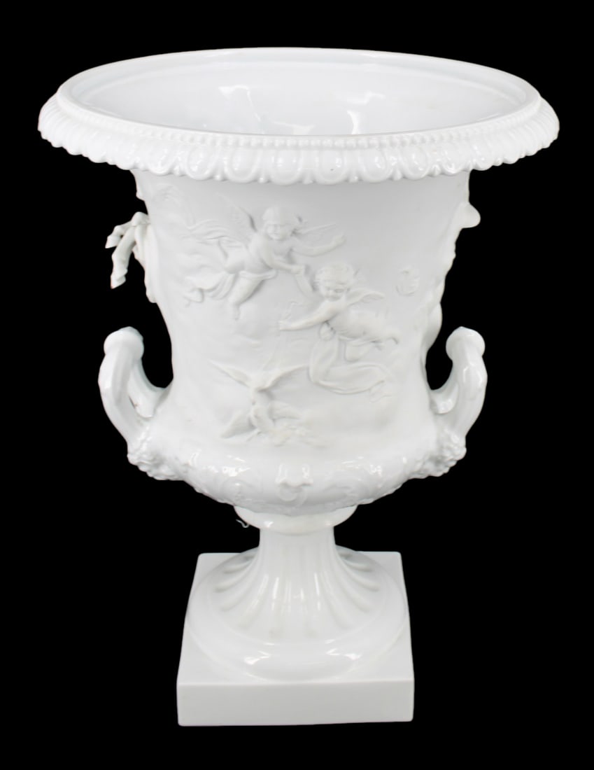 Richard Ginori - Trionfo Del Sole Bisque Urn: A bisque porcelain 'Trionfo Del Sole' urn by Richard Ginori. From a Scarsdale, NY collection. - Dimensions: 18.5" h x 14.5" w x 14.5" w.