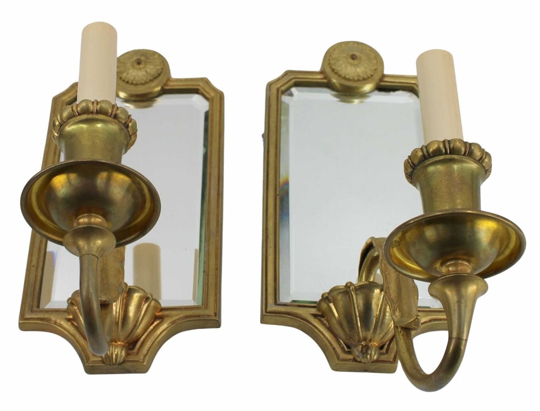 A Vintage Pair Of Brass Mirror Back Sconces.: From a Scarsdale, NY estate. - Dimensions: 12" h x 5" w.