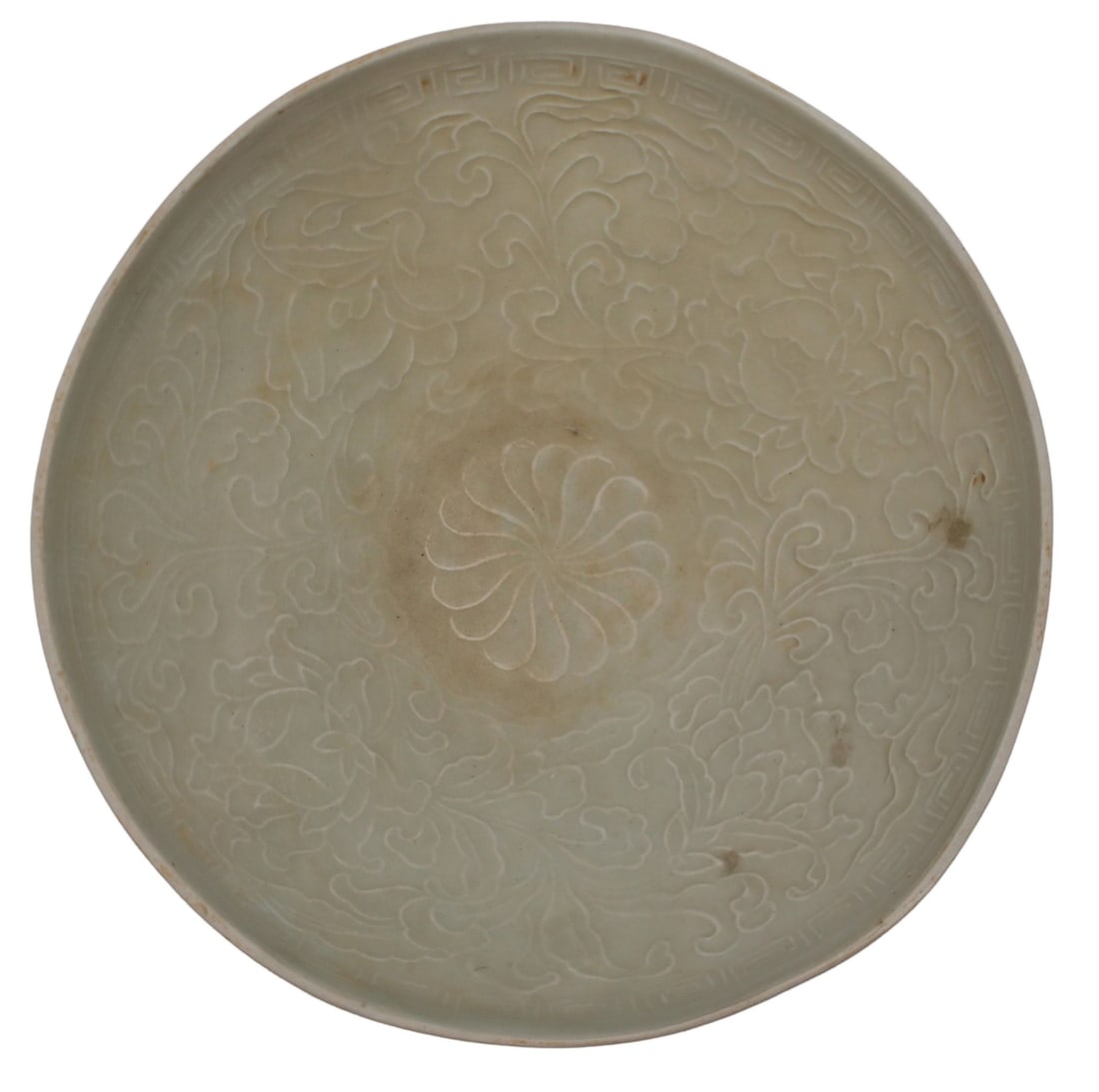 Chinese White Glazed Ding Bowl.: Chinese white glazed ding bowl is decorated with a mold-impressed arrangement of flowers with varying size and species as well as geometric designs. From a White Plains, NY estate. Dimensions: the din