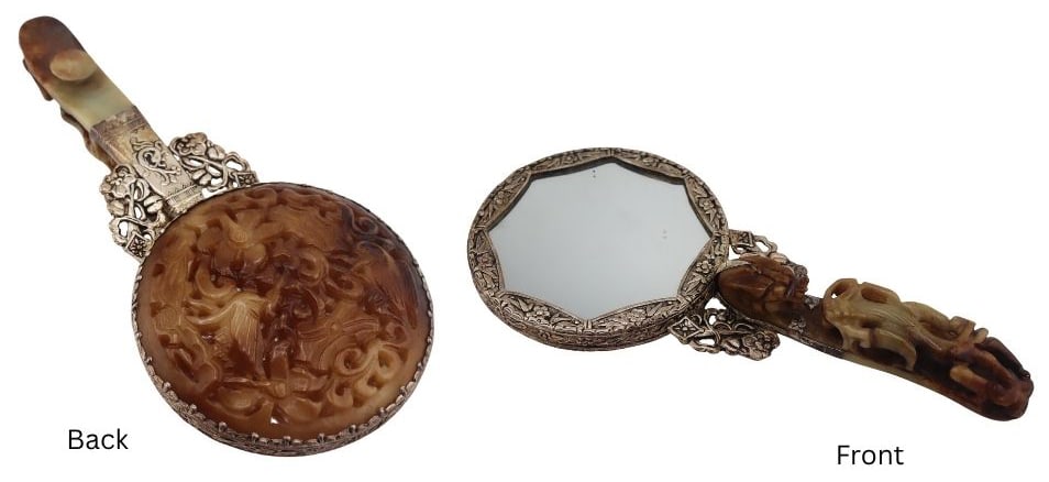 Chinese Carved Hardstone Hand Mirror.: Chinese silver-tone hand mirror displaying a carved hardstone dragon belt buckle repurposed as the handle, and a carved hardstone pierced panel of birds and flora to the underside of the mirror. From 