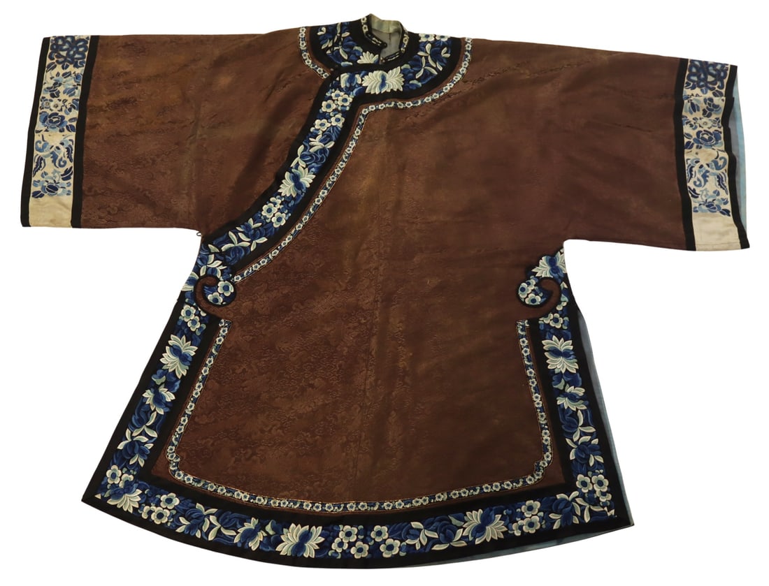 Chinese Floral Embroidered Brown Silk Robe.: Chinese brown silk embroidered robe accented by blue, white and black floral decorated borders. From a Bronx, NY estate. Dimensions: sleeve hem to sleeve hem measures approx. 58" in length; collar to 
