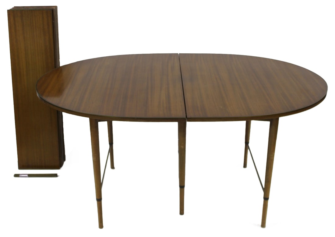 Paul McCobb for Calvin Midcentury Dropleaf Table.: Nice original table with brass trim and 6 leaves (11"). From a Great Neck, Long Island, NY estate. - Dimensions: 29.25" h x 62.5" x 41.25"