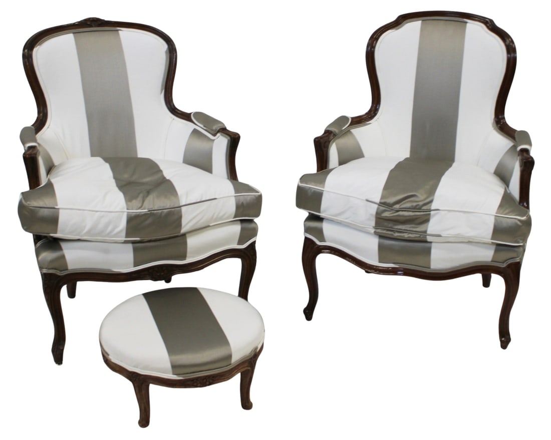 Fine Pair of Louis XV Style Silk Upholstered: Bergeres & Ottoman. Fine quality pair with striped silk upholstery. From an Ossining NY estate. Dimensions: 37.5" x 28" x 29", ottoman 9" x 17" dia.